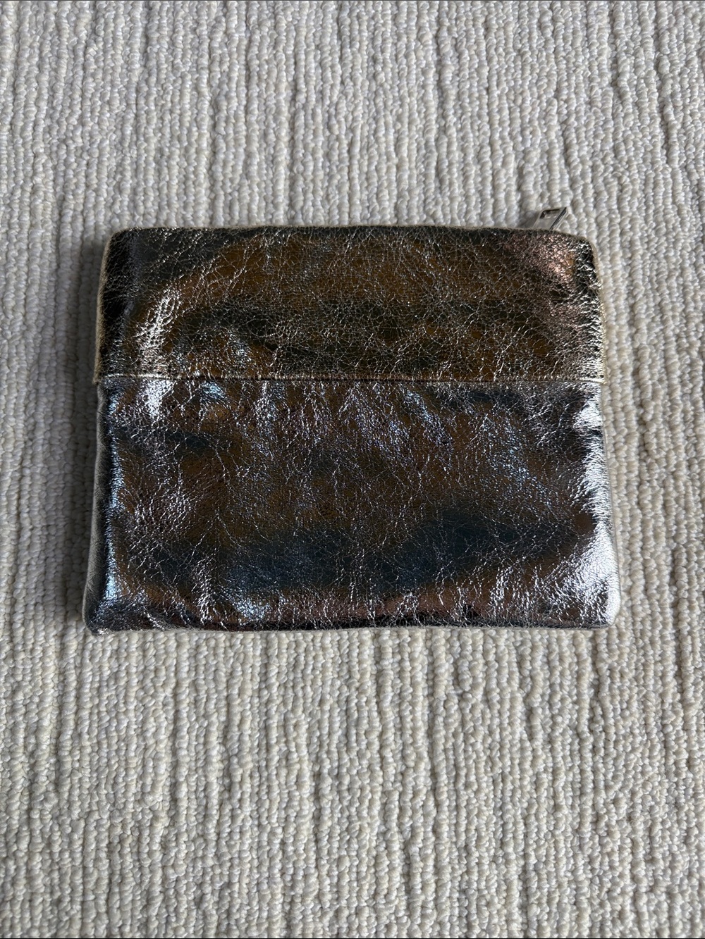 Metallic silver clutch with gold accent